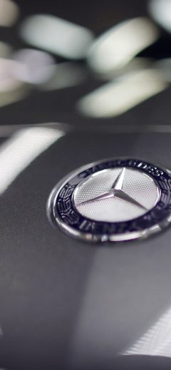 A company logo is seen on a Mercedes-Benz A-class car displayed in a dealership of German car manufacturer Daimler in Paris
